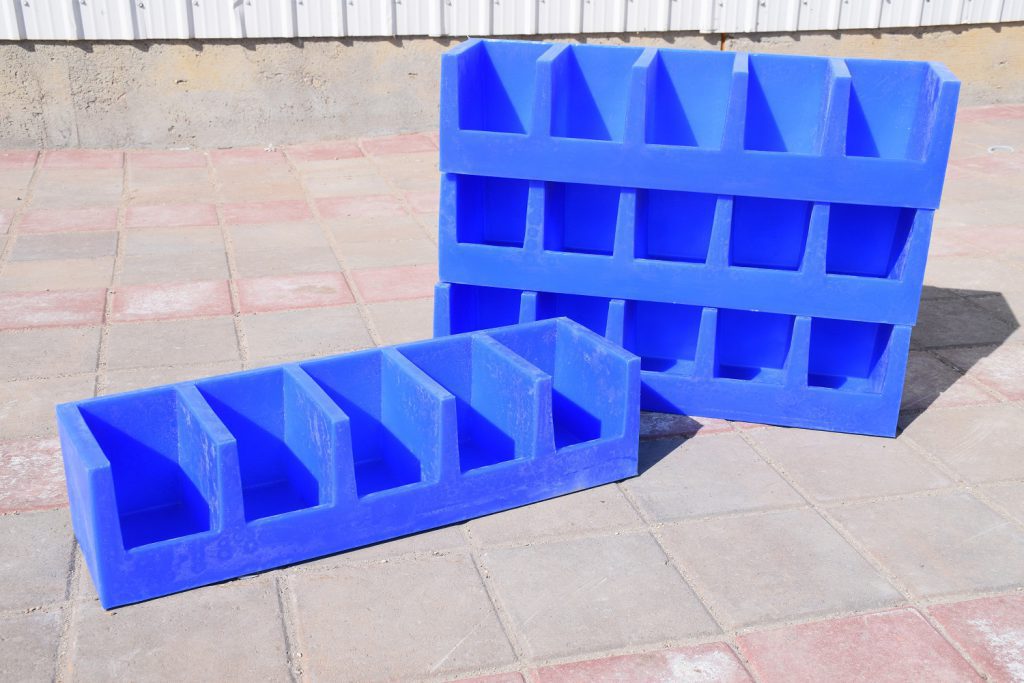 four blue plastic bolt bins stacked